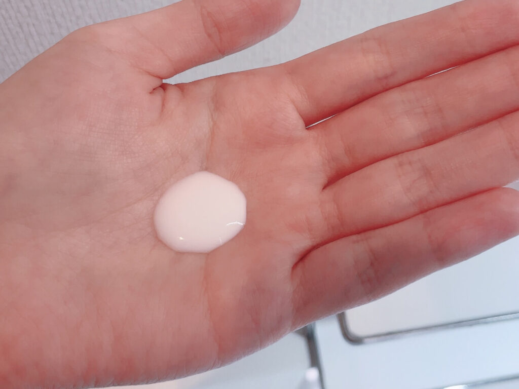 An appropriate amount of MUJI milk on palm