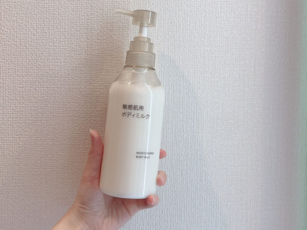 MUJI Sensitive Skin Body Milk bottle with pump head held in hand